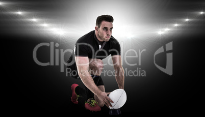 Composite image of rugby player getting ready to kick ball