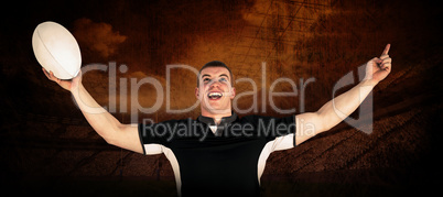 Composite image of a rugby player gesturing victory