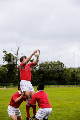 Rugby players jumping for line out