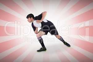 Composite image of rugby player running with the rugby ball