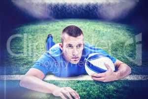 Composite image of rugby player looking away while lying in fron