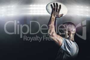 Composite image of rugby player throwing ball