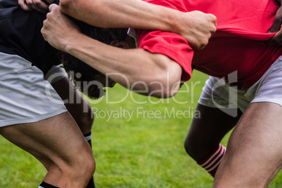 Rugby players doing a scrum