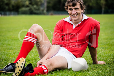 Rugby player sitting on grass before match Rugby player sitting on grass before match