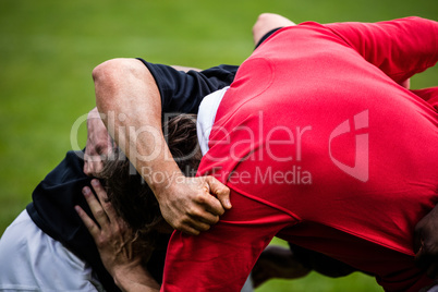 Rugby players doing a scrum