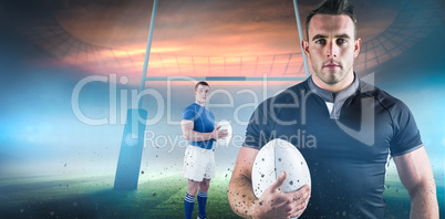 Composite image of rugby player holding rugby ball Composite image of rugby player holding rugby ball