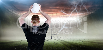 Composite image of rugby player about to throw a rugby ball