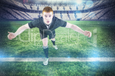 Composite image of rugby player tackling the opponent