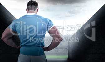 Composite image of rugby player with hands on hips