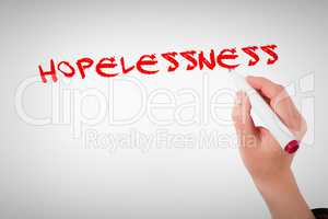 Hopelessness against businesswomans hand writing with marker
