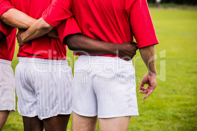 Rugby players standing together before match