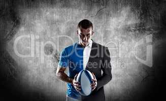 Composite image of rugby player holding ball