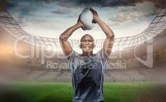 Composite image of determined sportsman throwing rugby ball