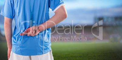 Composite image of rugby player with hands on hips