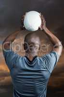 Composite image of rear view of athlete throwing rugby ball