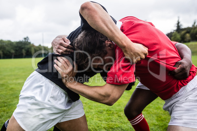 Rugby players doing a scrum