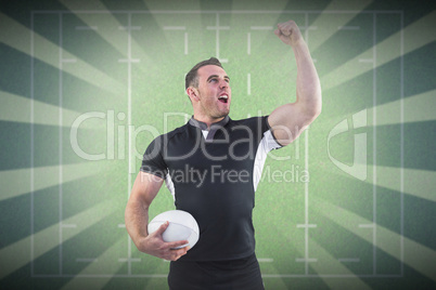 Composite image of rugby player cheering with the ball