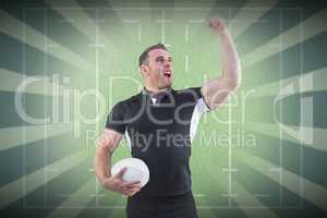 Composite image of rugby player cheering with the ball