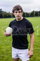 Rugby player scowling at camera