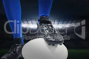 Composite image of low section of of rugby player on ball