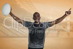 Composite image of confident sportsman with arms raised holding