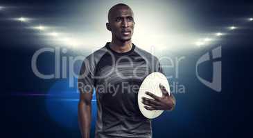 Composite image of thoughtful athlete holding rugby ball