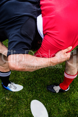 Rugby players doing a scrum