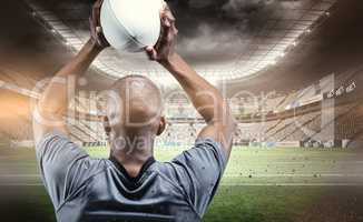 Composite image of sportsman throwing rugby ball