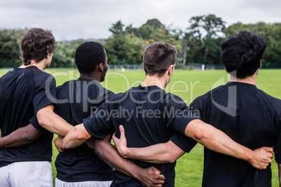 Rugby players standing together before match