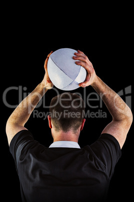 Composite image of rugby player about to throw a rugby ball