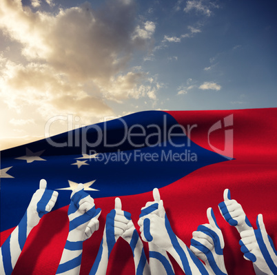 Composite image of group of hands giving thumbs up