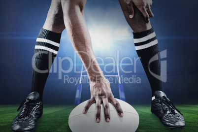 Composite image of low section of athlete playing rugby