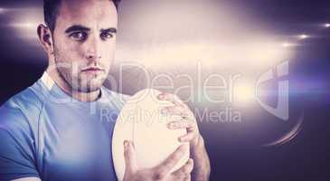 Composite image of rugby player looking at camera