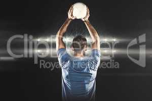 Composite image of rear view of sports player throwing ball