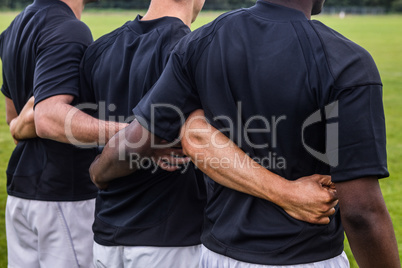 Rugby players standing together before match