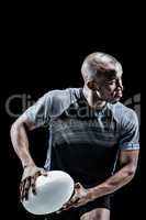 Composite image of athlete running with rugby ball