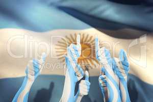 Composite image of hands up and thumbs raised