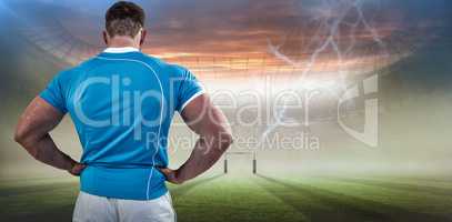 Composite image of rugby player with hands on hips