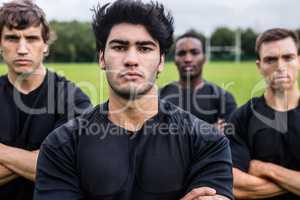 Rugby players scowling at camera