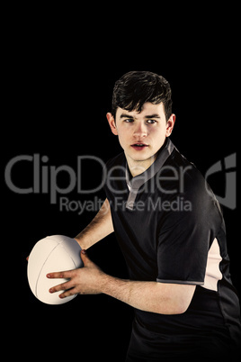 Composite image of rugby player about to throw a rugby ball