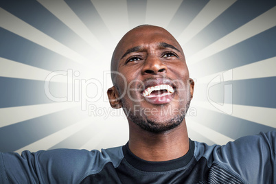 Composite image of close-up of cheerful sportsman