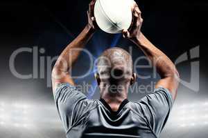 Composite image of sportsman throwing rugby ball