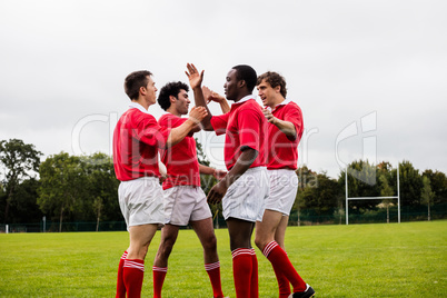 Rugby players celebrating a win