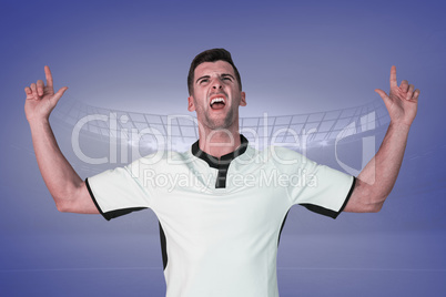 Composite image of excited rugby player pointing up