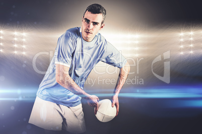 Composite image of rugby player about to throw a rugby ball