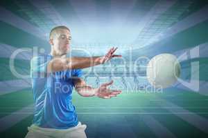 Composite image of rugby player catching the ball