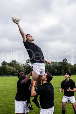 Rugby players jumping for line out