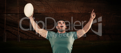 Composite image of rugby player cheering and pointing