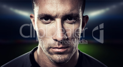 Composite image of close-up portrait of serious rugby player