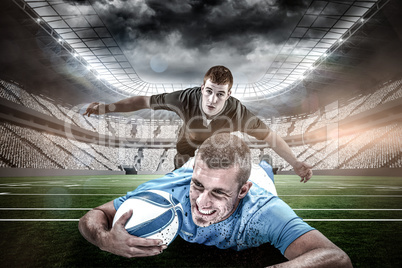 Composite image of confident rugby player lying in front with ball